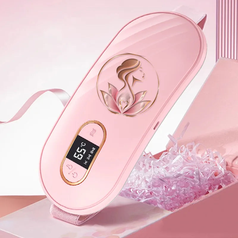 La ceinture chauffante Lumae rose poudré, avec son logo doré et son écran de température.